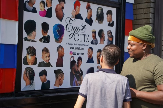 Ego Cutz storefront and service board